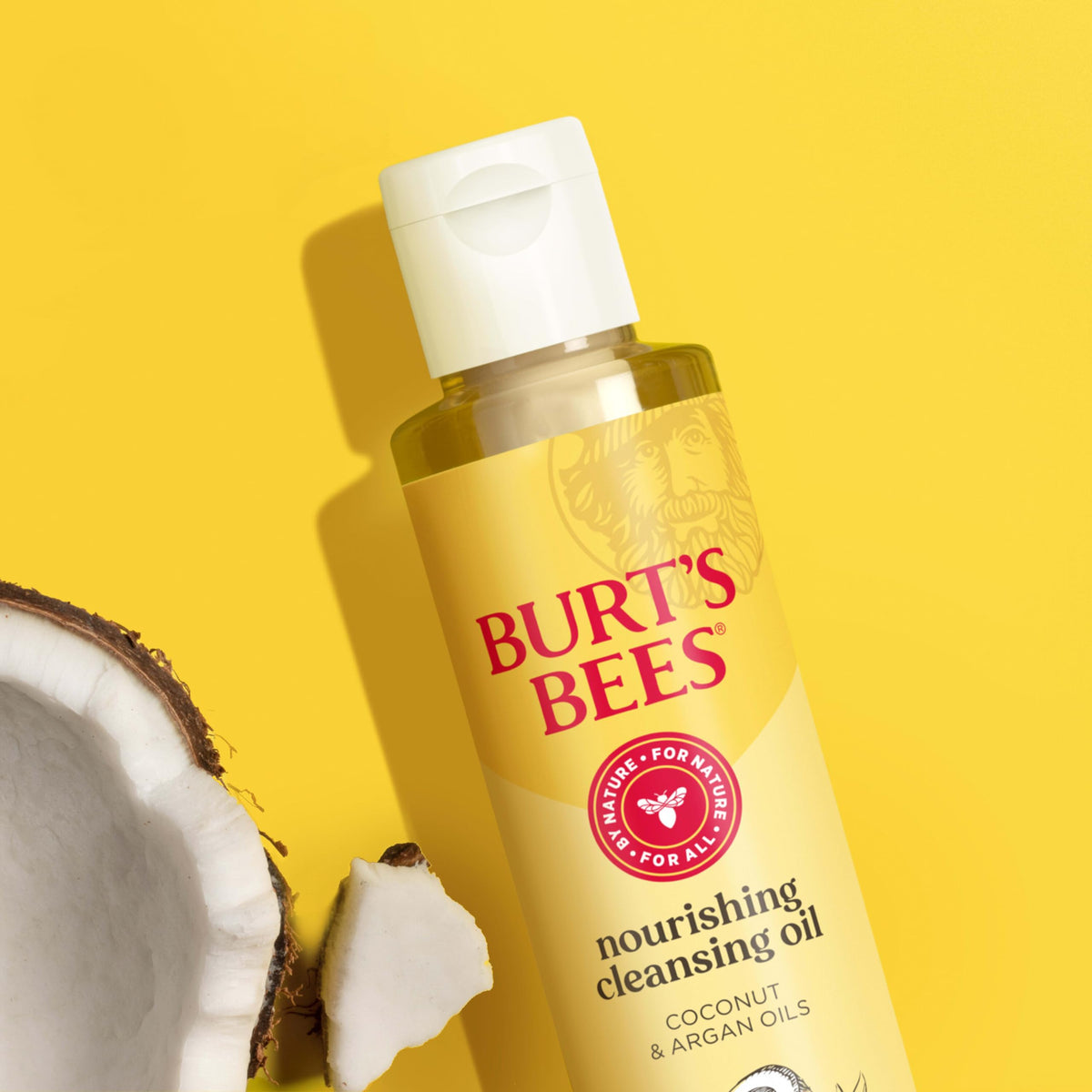 Burt's Bees bottle held in hand for size comparison and portability benefit