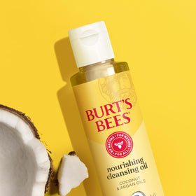 Burt's Bees bottle held in hand for size comparison and portability benefit