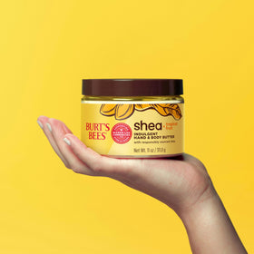 11 oz Burt's Bees tub held in hand demonstrating product size and travel convenience