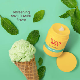 Burt's Bees 0.5 oz tube in hand to show compact travel-friendly size