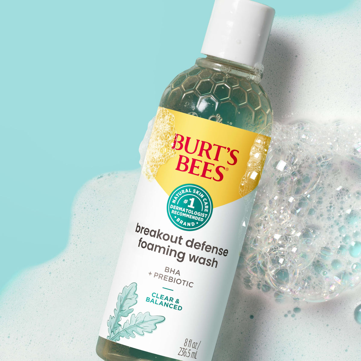 Burt's Bees bottle in hand showing 8 oz size for scale comparison