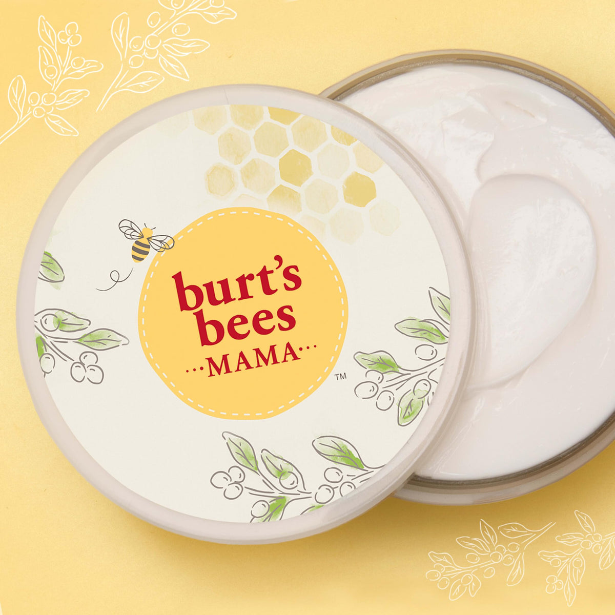 Burt's Bees spoon scooping cream demonstrating thick balm consistency and spreadability