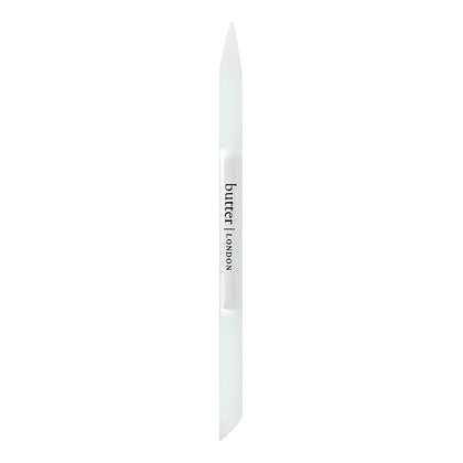 butter LONDON glass cuticle pusher front view showcasing compact design and durability