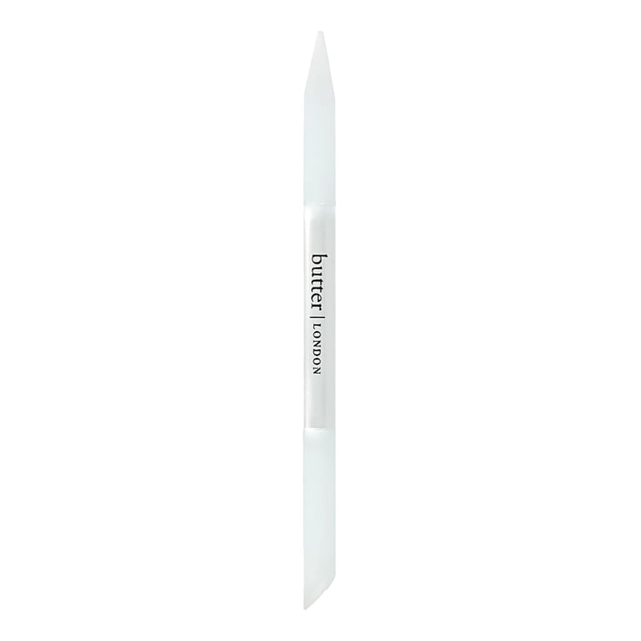 butter LONDON glass cuticle pusher front view showcasing compact design and durability