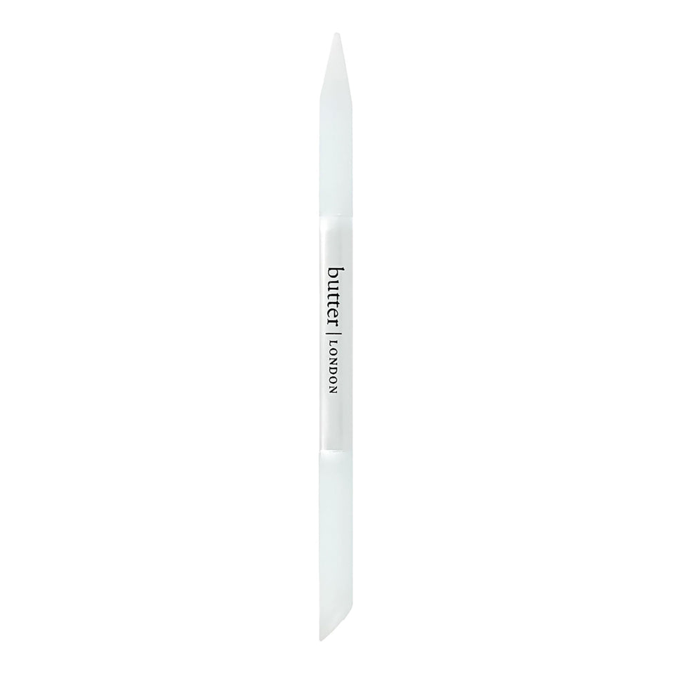 butter LONDON glass cuticle pusher front view showcasing compact design and durability