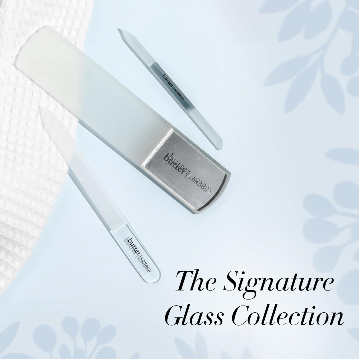 butter LONDON cuticle pusher beside ruler showing travel-friendly compact size