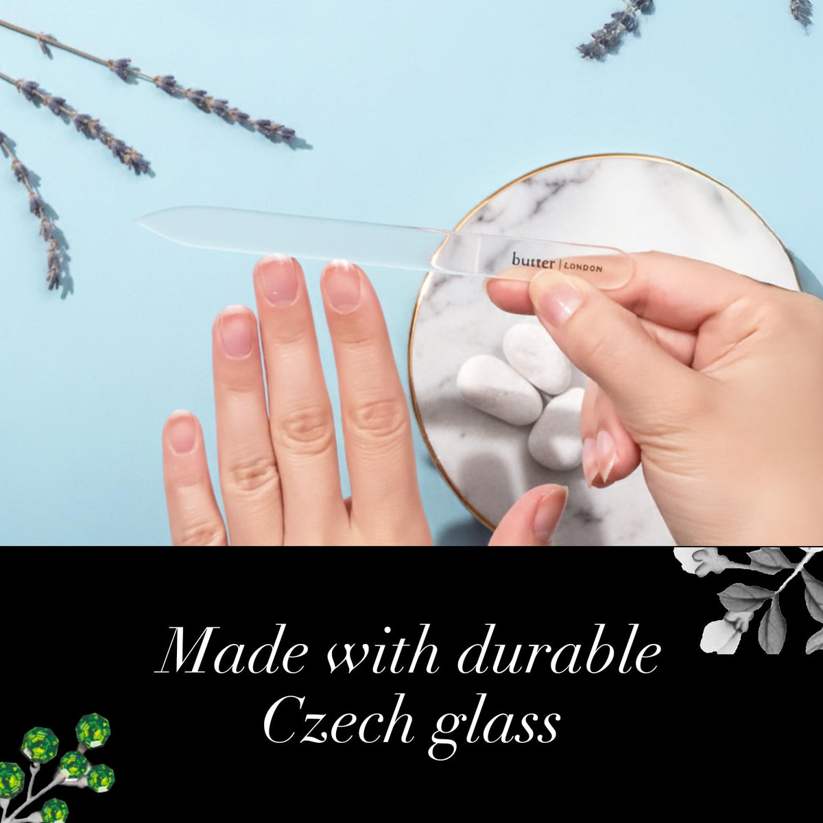 butter LONDON glass file beside coins showing compact size for travel convenience