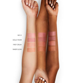 BUXOM balm applied on lips delivering tint and hydrated appearance