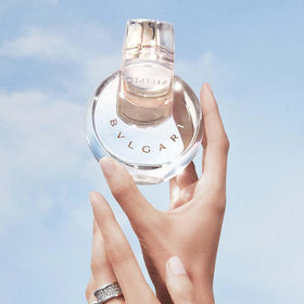 Bvlgari Omnia Crystalline next to ruler showing 3.4 oz size for travel convenience