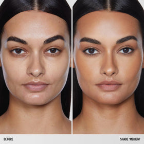 BY MARIO SoftSculpt in a bathroom mirror lifestyle shot conveying effortless daily use and natural glow