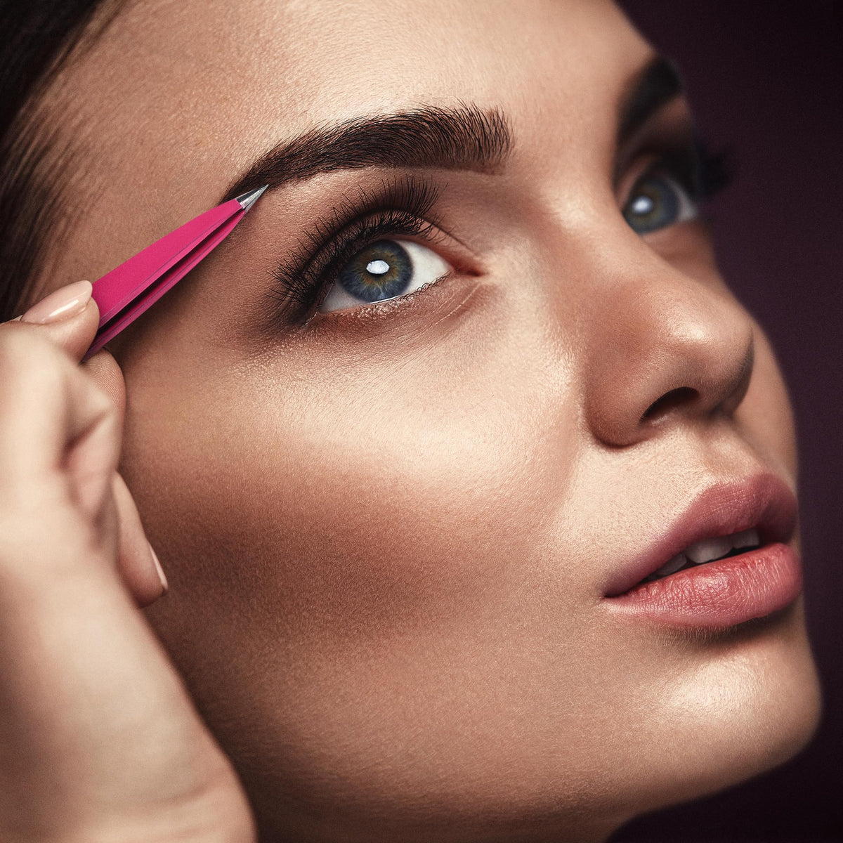 By MILLY tweezers extracting a splinter demonstrating precision and safe removal