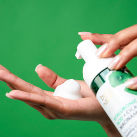 By Nature cleanser pump dispensing soft foam, demonstrates gentle effective lather