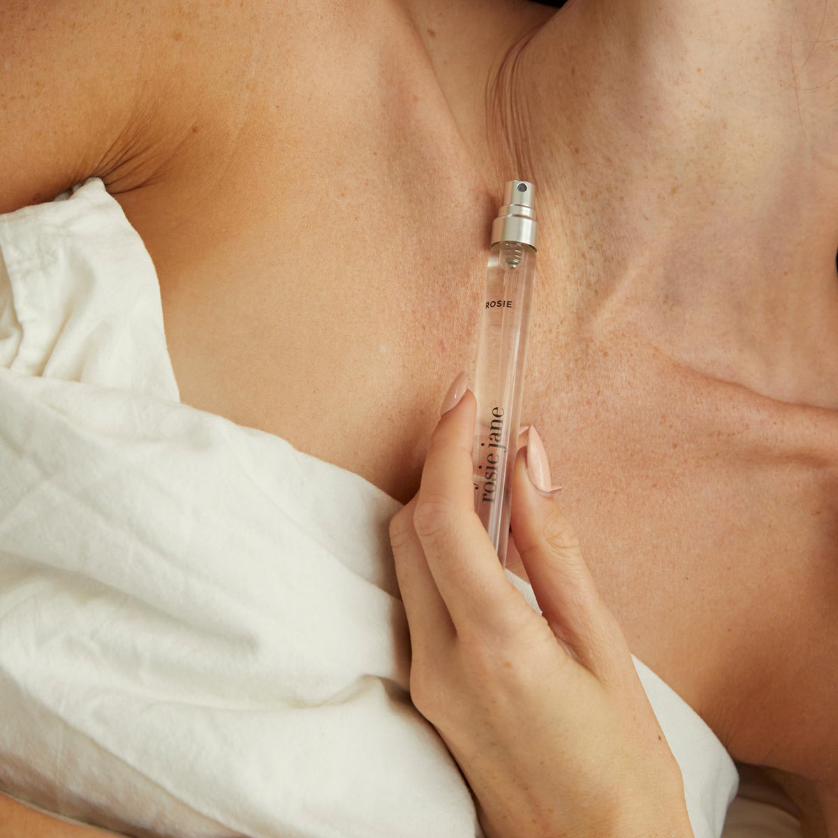 By Rosie Jane spray in hand being applied to wrist benefit: discreet refresh on the go