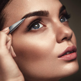 By MILLY tweezers held in hand demonstrating ergonomic control and accuracy
