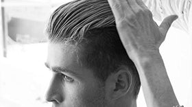 BYRD matte pomade displayed with included back-pocket comb for precise styling