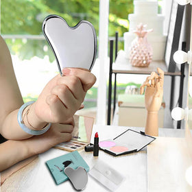 BYYDDIY gua sha beside serum bottle showing compatibility with products benefit