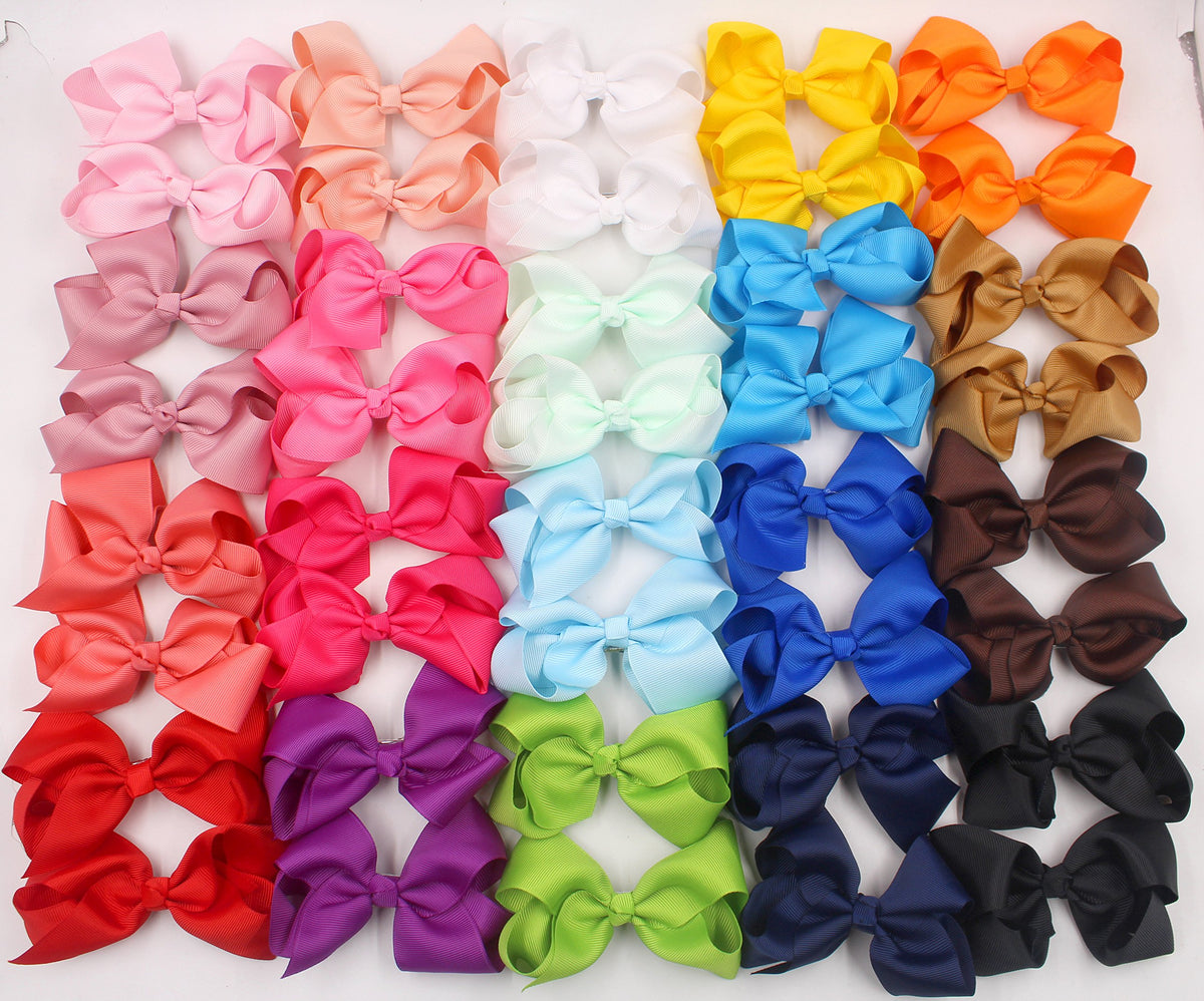 CÉLLOT bows arranged in photography setup for polished portraits