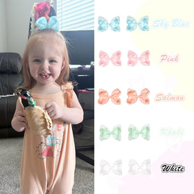 CÉLLOT bow clipped in toddler ponytail demonstrating comfortable wear