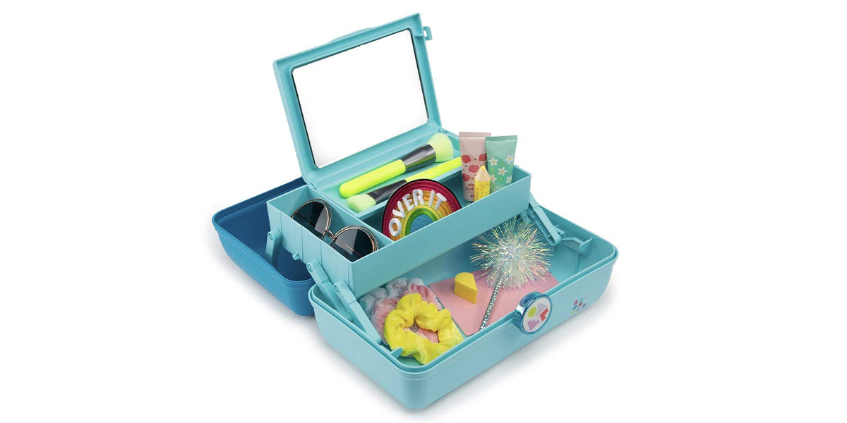 Caboodles organizer in travel setting with makeup and brushes neatly stored