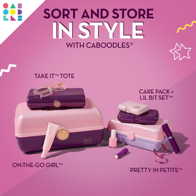 Caboodles next to hand and purse to show scale and easy carrying convenience