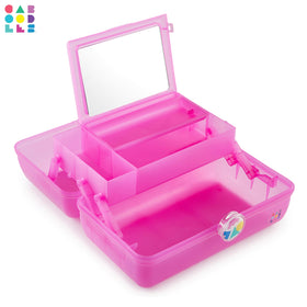 Caboodles beside brushes and palette showing scale and roomy capacity