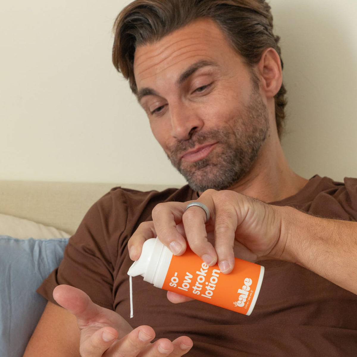 cake bottle on nightstand lifestyle image showing quick-access storage for solo sessions