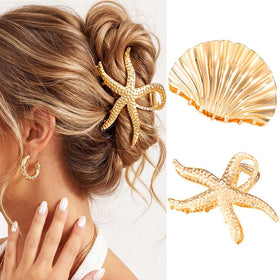 CAKURE front view of gold starfish and seashell clips, stylish beach look