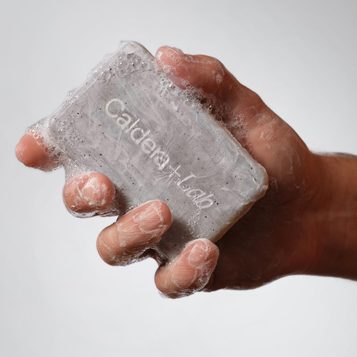 Caldera + Lab lather in hand demonstrating rich foam for full-body cleansing