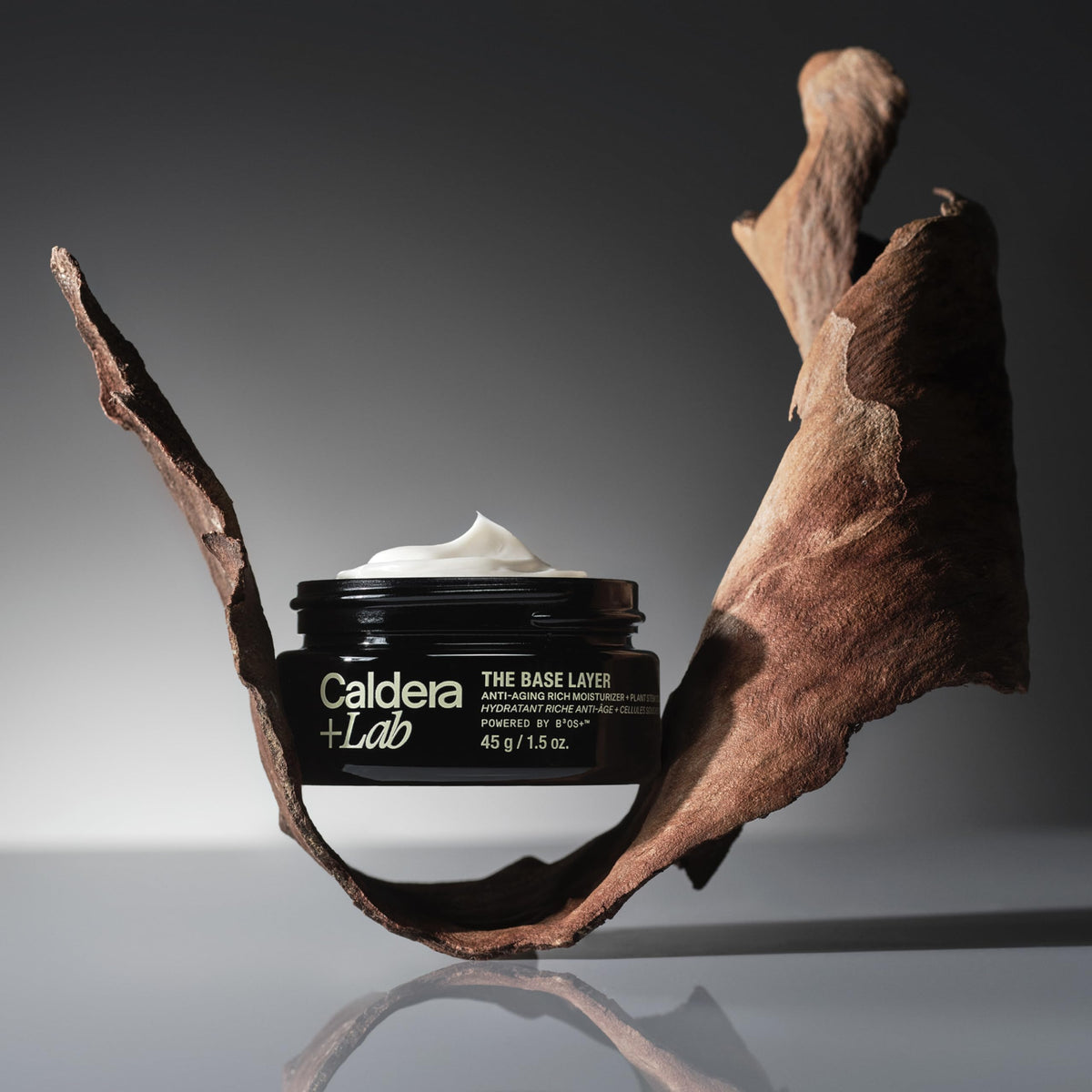Caldera + Lab product held in hand showing size and travel-friendly scale