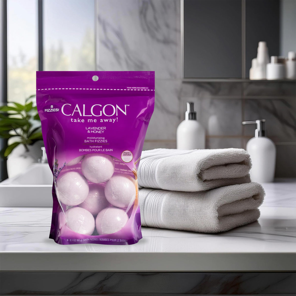 Calgon bath fizzy held in hand to show size and easy single-use portion