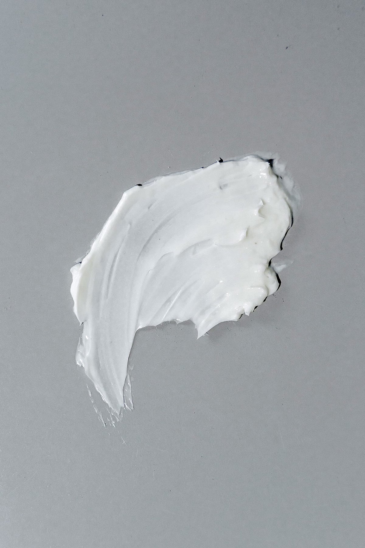 California Born styling cream being applied to wet hair for easy distribution