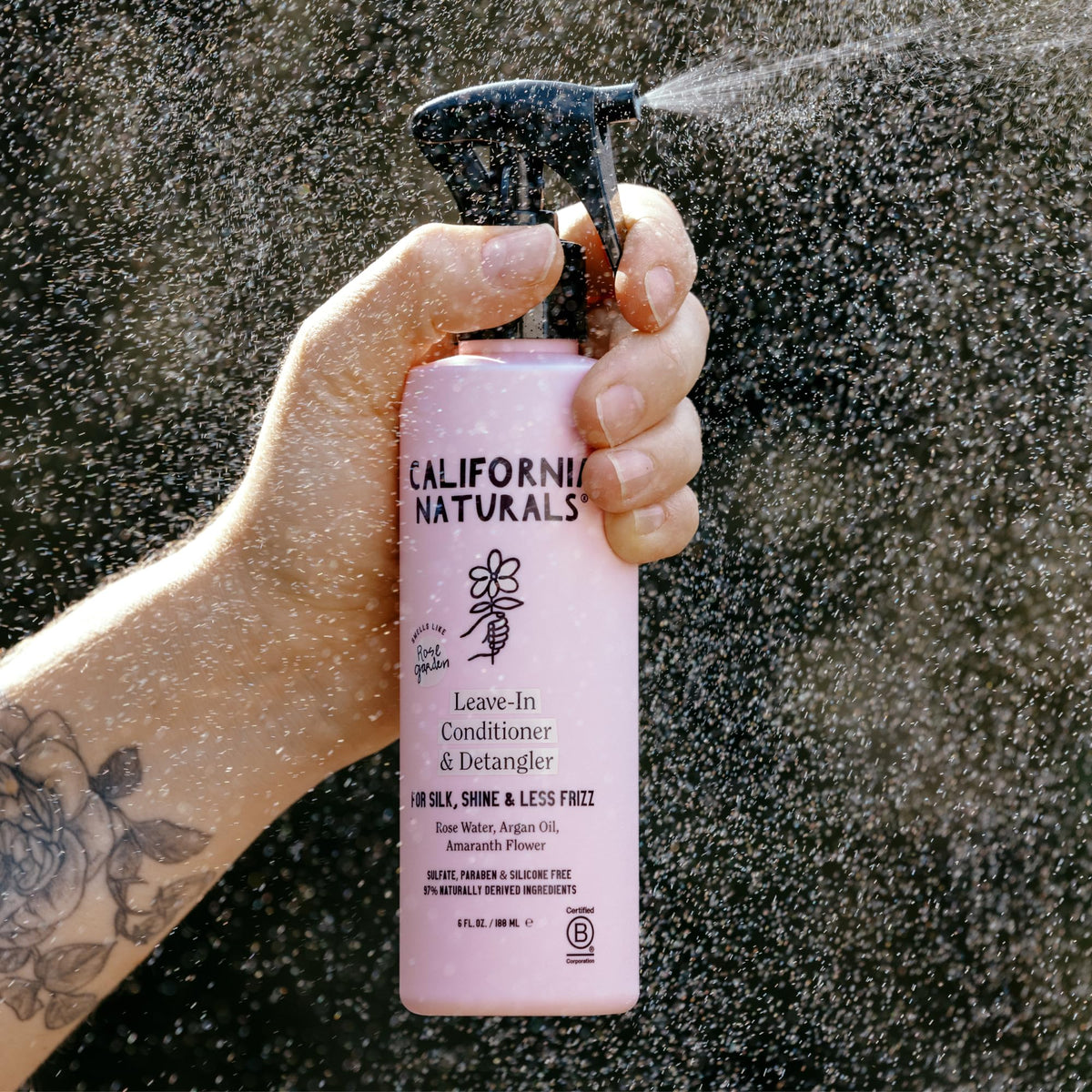 Rose water and argan oil ingredients with California Naturals label, emphasizes shine boost