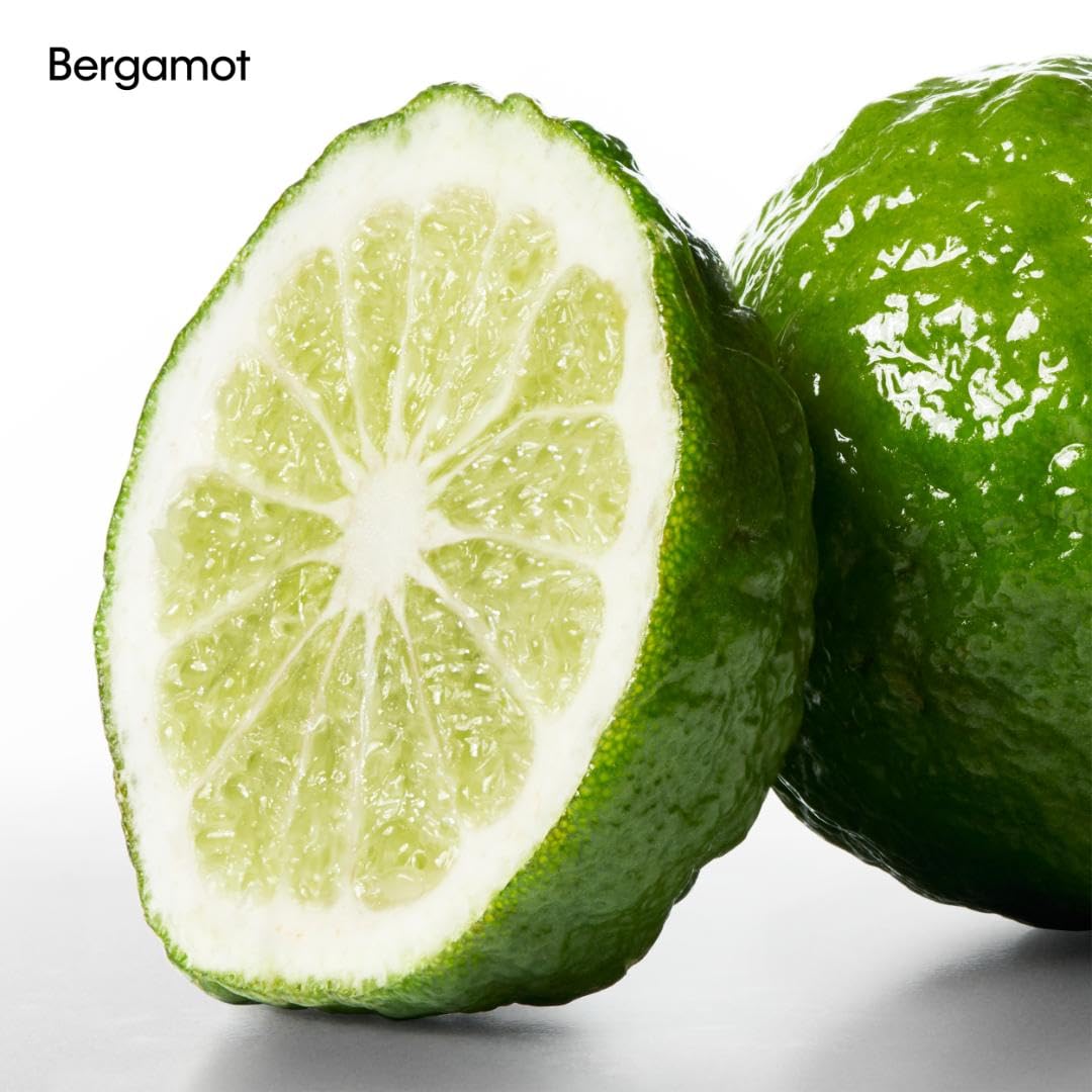 Calvin Klein CK One deodorant held in hand to show compact travel-friendly size