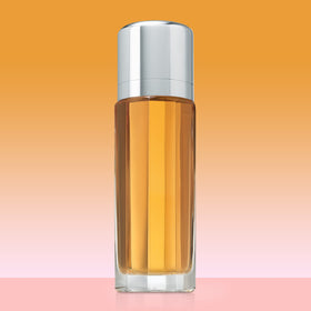 Calvin Klein Escape atomizer spraying a fine mist, illustrating easy application benefit