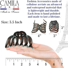 Camila Paris securing a half-up style quickly and neatly