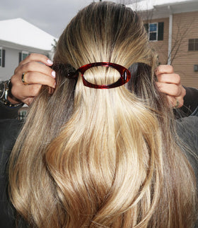 Camila Paris side profile of barrette highlighting curved fit and comfortable grip