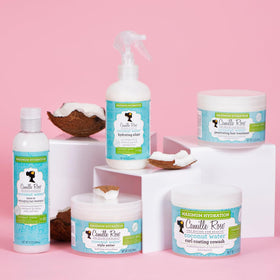 Coconut water, coconut oil, castor oil displayed with Camille Rose bottle