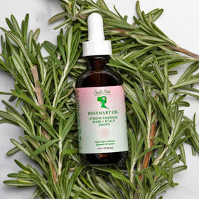 Camille Rose oil applied to hair ends showing split-end smoothing benefit