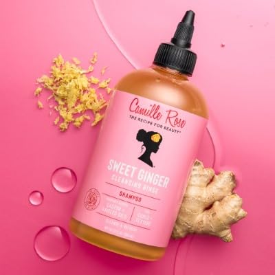 Camille Rose bottle held in hand for scale, conveys size and easy dispensing
