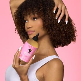 Camille Rose shampoo in shower on tile shelf, lifestyle scene shows refreshing daily use