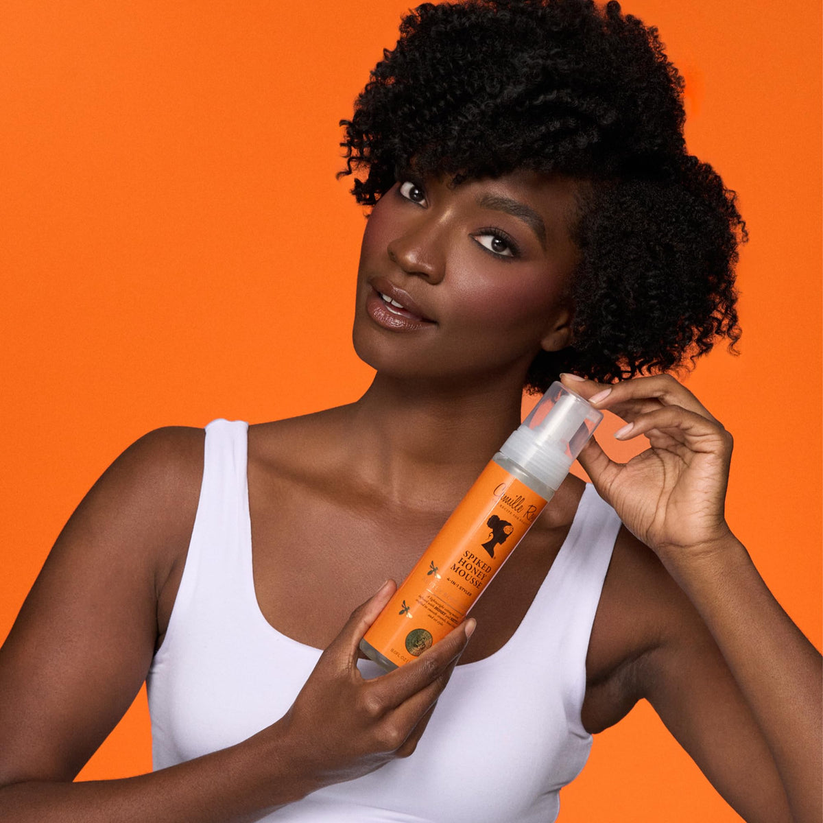Camille Rose being applied to damp curls to define and reduce frizz during styling