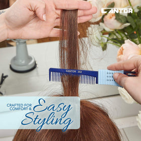 Cantor comb beside hand for scale demonstrating compact, easy-to-carry size