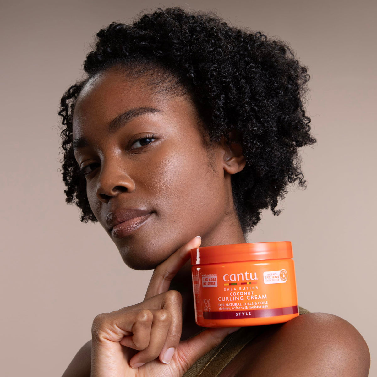 Cantu application on wet curls showing improved curl clumping and softness