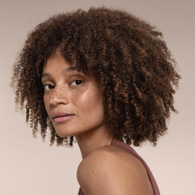 Cantu texture shot with shea butter droplet for moisturizing effect