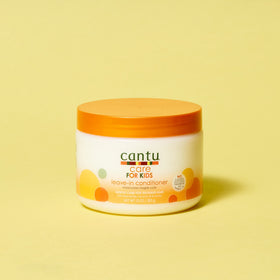 Cantu product applied while detangling child's hair demonstrating reduced breakage