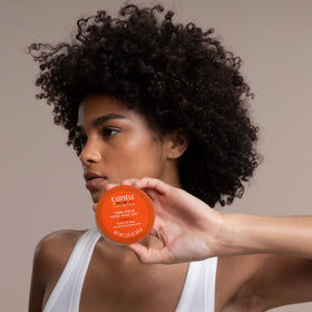 Close-up of hairline using Cantu gel to smooth baby hairs and reduce frizz