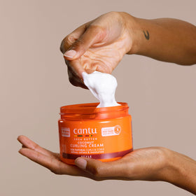Cantu label close-up showing shea butter coconut oils and clean formulation