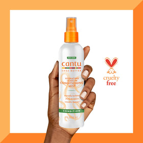 Cantu styling in use lifestyle shot smoothing flyaways for polished finish benefit