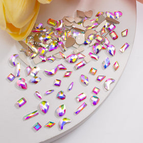 CANVALITE tweezers and wax picker beside gems for precise, mess-free placement
