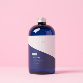Foamy lather from Capri Blue Volcano on hands demonstrating gentle cleanse and soft skin benefit